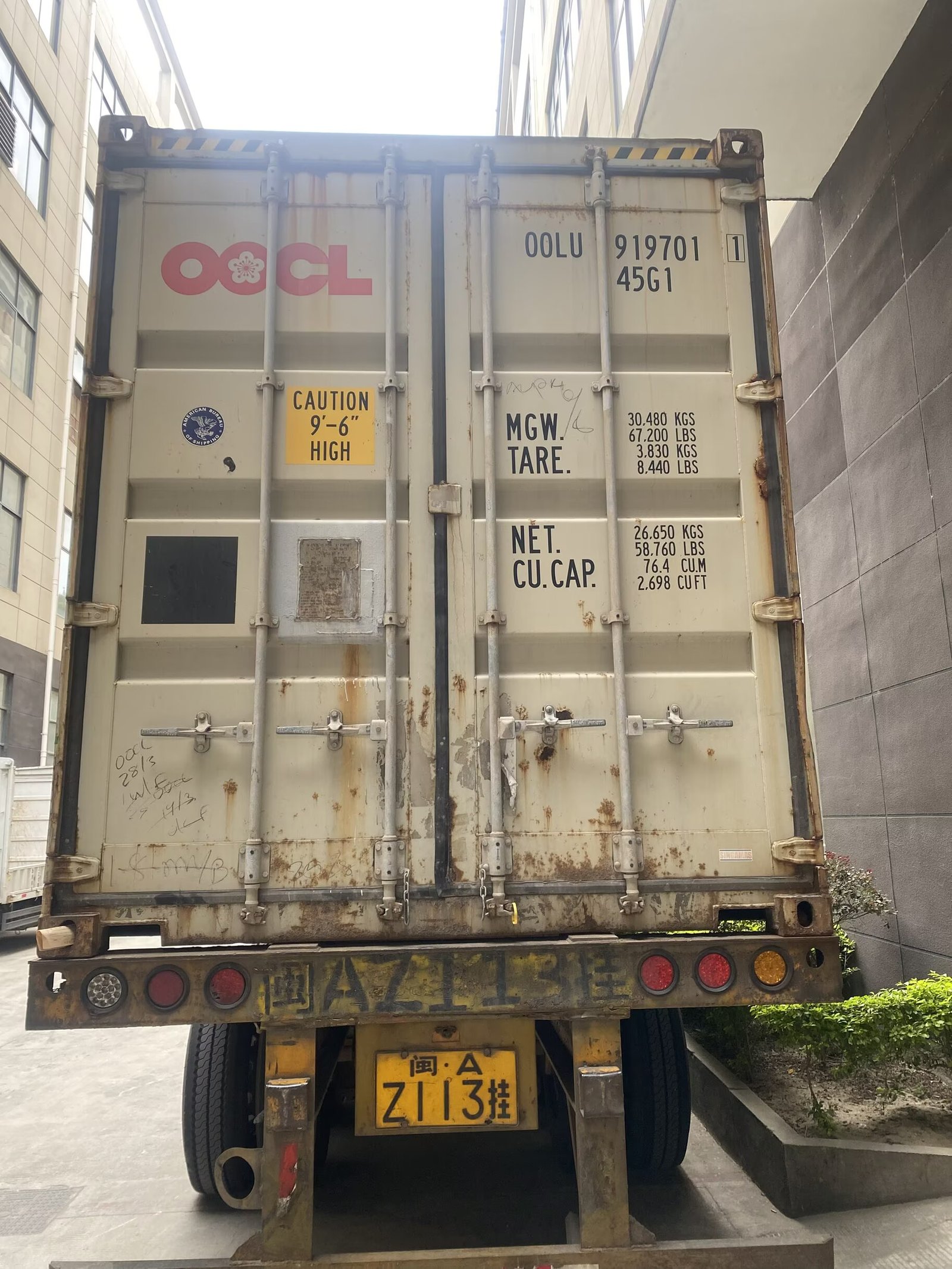 Export container being loaded with storage ottomans at port