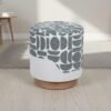 Round upholstered stool with natural wood base