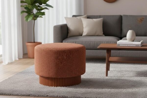 Textured orange boucle fabric upholstered footstool