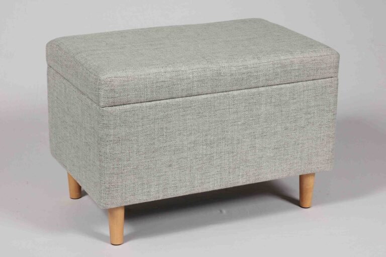 A modern circular velvet stool with a removable lid revealing a hidden storage compartment, ideal for decluttering small urban living rooms.
