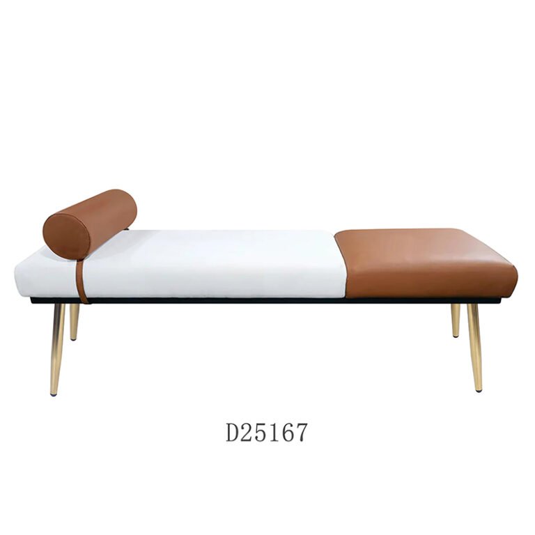 A sophisticated gold storage bench with velvet upholstery and polished metal legs, placed at the foot of a bed in a modern, elegant bedroom.