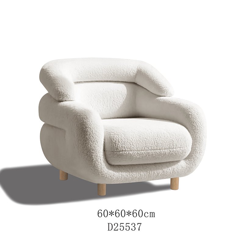 A plush, textured chenille ottoman with a rich, iridescent sheen, styled as a sophisticated accent piece in a modern, neutral-toned living room.