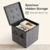 A charcoal grey fabric storage ottoman shown in three states: fully assembled as a cube, folded flat for storage, and the tufted lid used as a serving tray with a coffee cup. Text reads "3-IN-1 Storage Ottoman: Sit | Store | Serve.