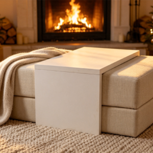 A contemporary white upholstered modular ottoman with an integrated over-couch bridge table.