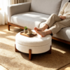 Close-up of padded cushion top on white round coffee table with ottomans