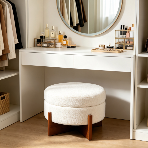 Modern white round coffee table with ottomans styled near vanity desk in bedroom