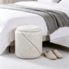 Small round white storage ottoman with reversible lid as coffee table