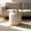 Small round white storage ottoman with reversible lid as coffee table