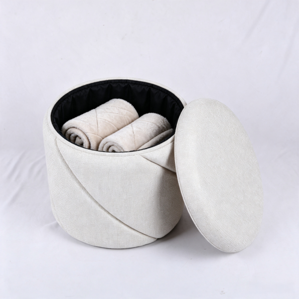 Open lid showing inside storage space of white textured fabric ottoman