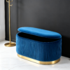 Navy blue velvet storage ottoman set with lids removed showing internal storage capacity