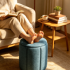 Blue Pleated Linen Ottoman Footstool in Modern Living Room Blue pleated linen storage ottoman used as a footstool in a cozy modern living room setting