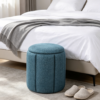 Blue Pleated Linen Ottoman Footstool in Modern Living Room Blue pleated linen round stool used as side table in modern living room corner