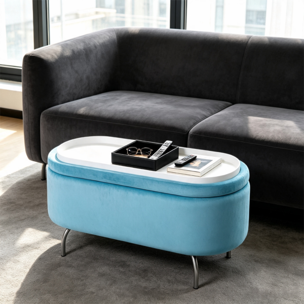 Light blue velvet oval storage ottoman featuring thin metal legs and a reversible wooden top tray in a modern living room setting.