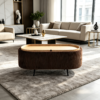 Brown oval ottoman footstool showing removable wooden tray top used as a coffee table