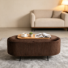 Modern brown storage bench ottoman used as an end of bed bench in a bedroom