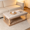 Top 1 Tufted Ottoman Coffee Table Designs with Wooden Tray | Fuzhou Victor Square beige tufted upholstered ottoman coffee table with light natural wood frame and open lower storage shelf.