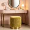 Reversible wooden lid top of round yellow velvet storage footstool