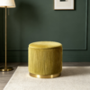 Modern mustard yellow velvet ottoman used as footrest in modern living room